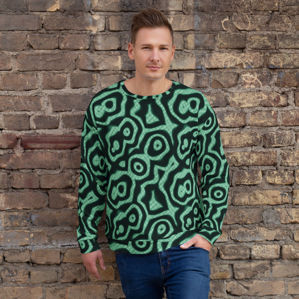 Sudadera de estampado integral Malaquita sobre modelo, pared de ladrillo