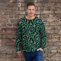 Sudadera de estampado integral Malaquita sobre modelo, pared de ladrillo