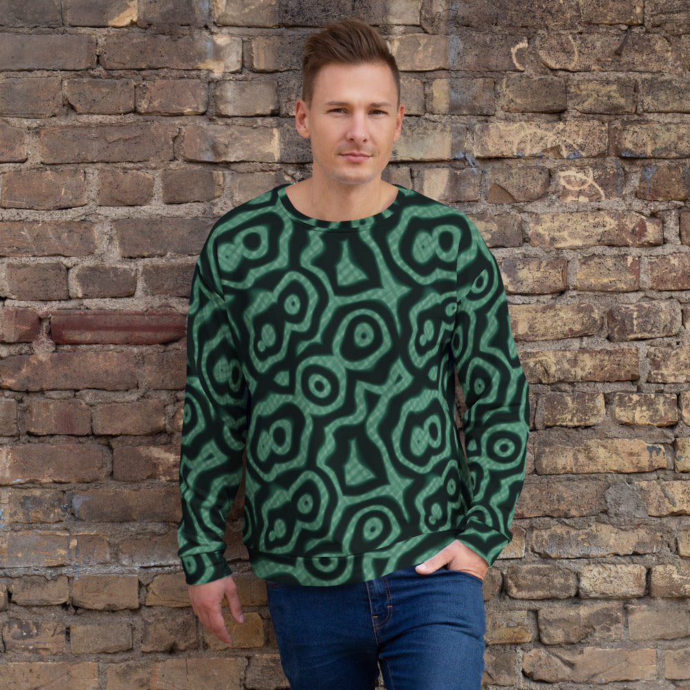 Sudadera de estampado integral Malaquita sobre modelo, pared de ladrillo
