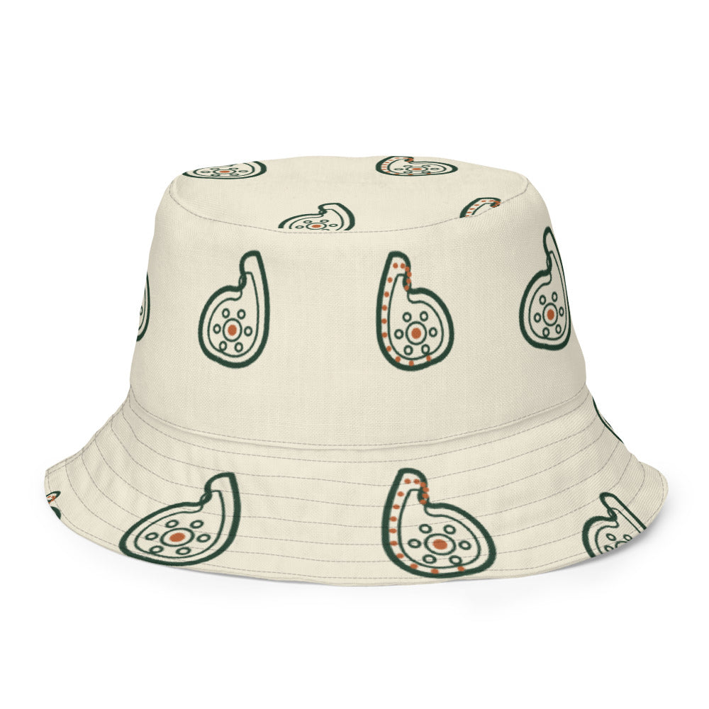 Bucket hat reversible — exterior crema con paisley verde