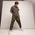 Pantalón Integral Pitón — Piel Real, escamas en oro y oliva, sobre modelo