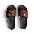 Slides negros con tira burdeos, corona dorada y siglas SRH — vista superior